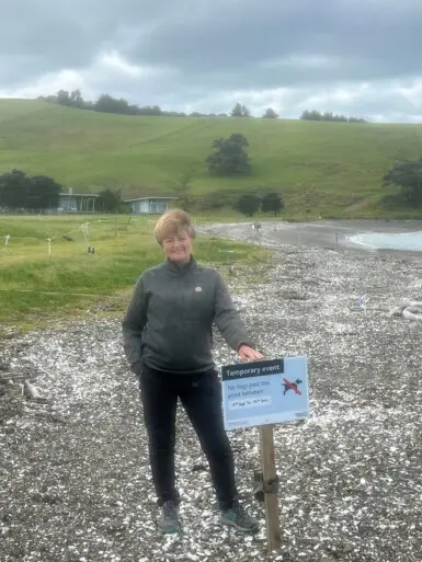 Gabrielle in front of area being protected to assist dotterel nesting at Church Bay