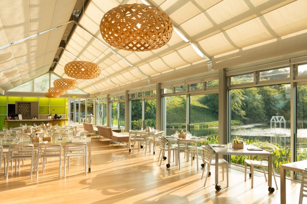 Inside the light-filled Glass House restaurant at Brick Bay