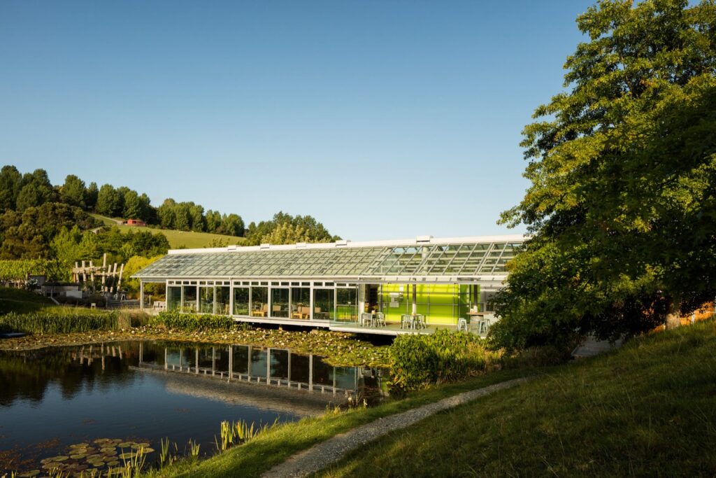 The Brick Bay Glass House restaurant beside the lake, Matakana