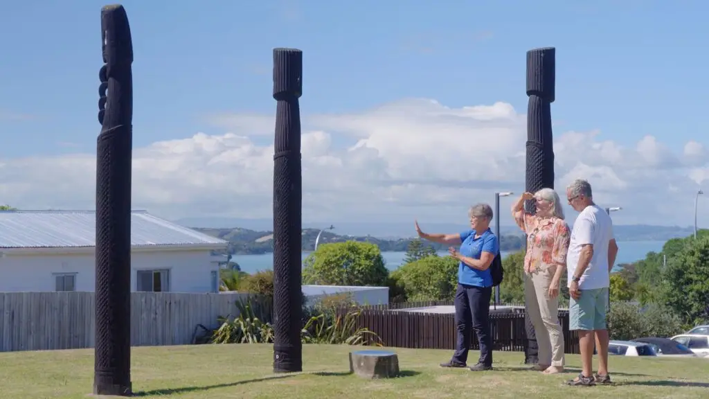 Guide explaining about the Pou, Terra & Tide Waiheke History & Heritage Tour