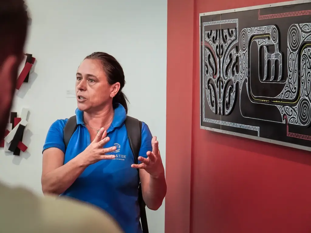 Guide sharing Waiheke history with guests at a gallery