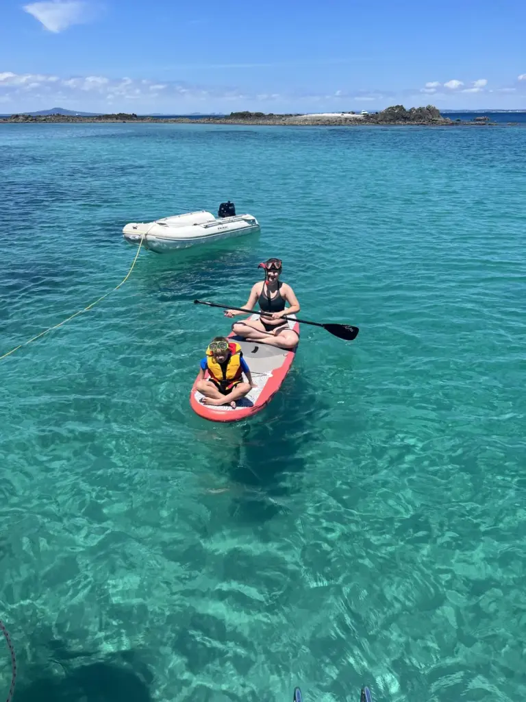 Paddleboarding at Hobbs Beach Tiritiri Matangi, Terra & Tide Hauraki Gulf Eco Sailing Adventure