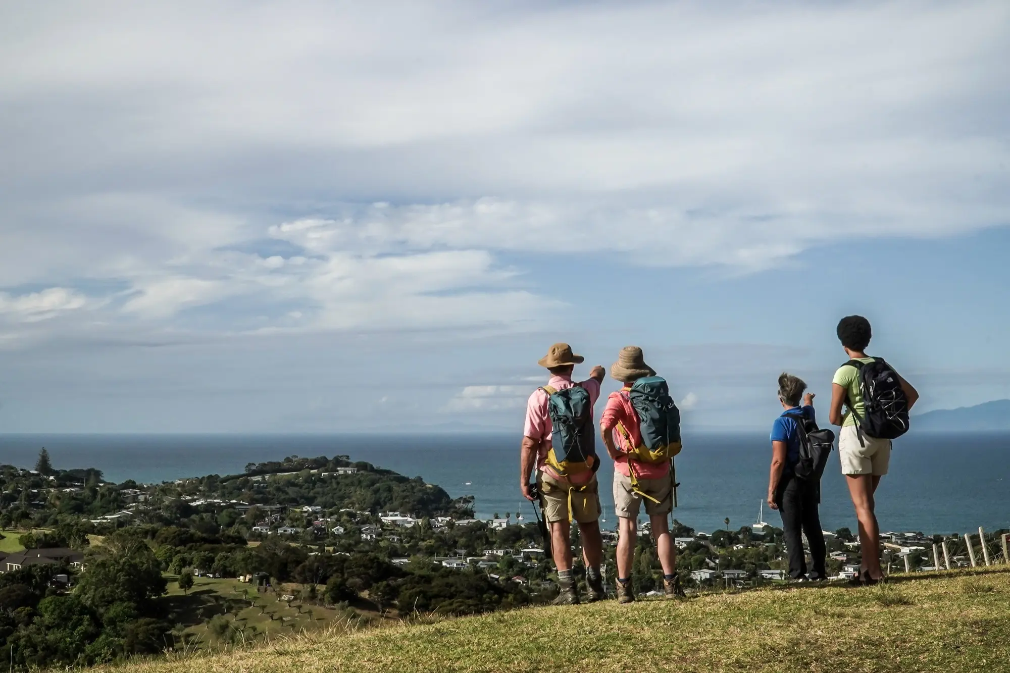 Guide and guests at a lookout above Oneroa, Waiheke Island