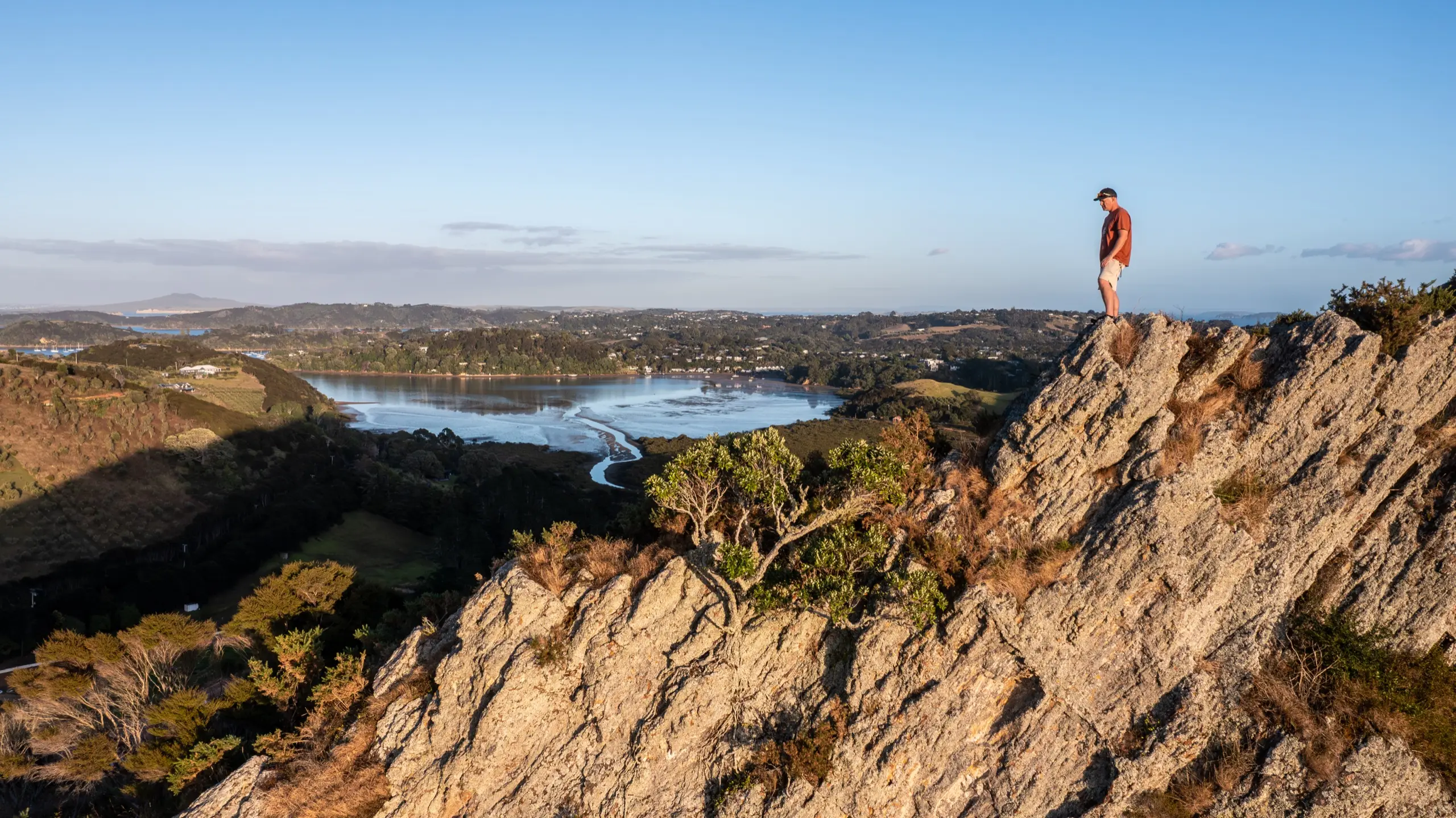 Walker on Putiki o Kahu during the Te Ara Hura walk, one of Terra & Tide's Waiheke Island multi day holidays